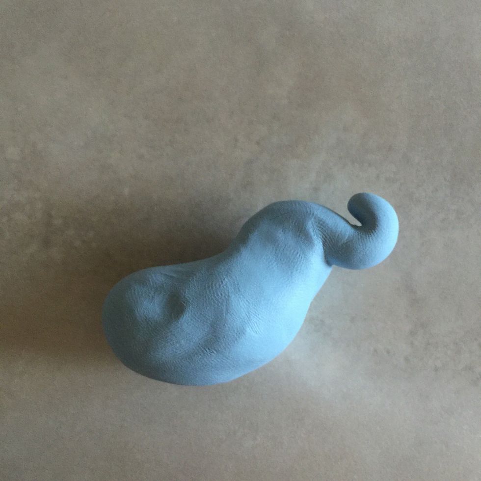 Pinch the end of the trunk to tilt upwards.