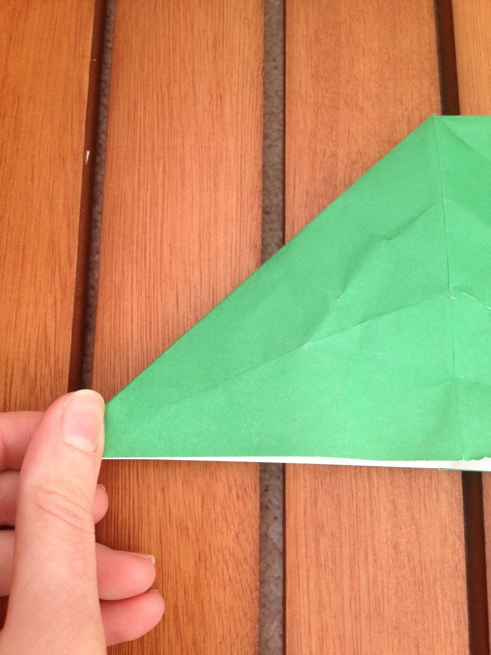 Pinch the left bottom corner of the triangle side...