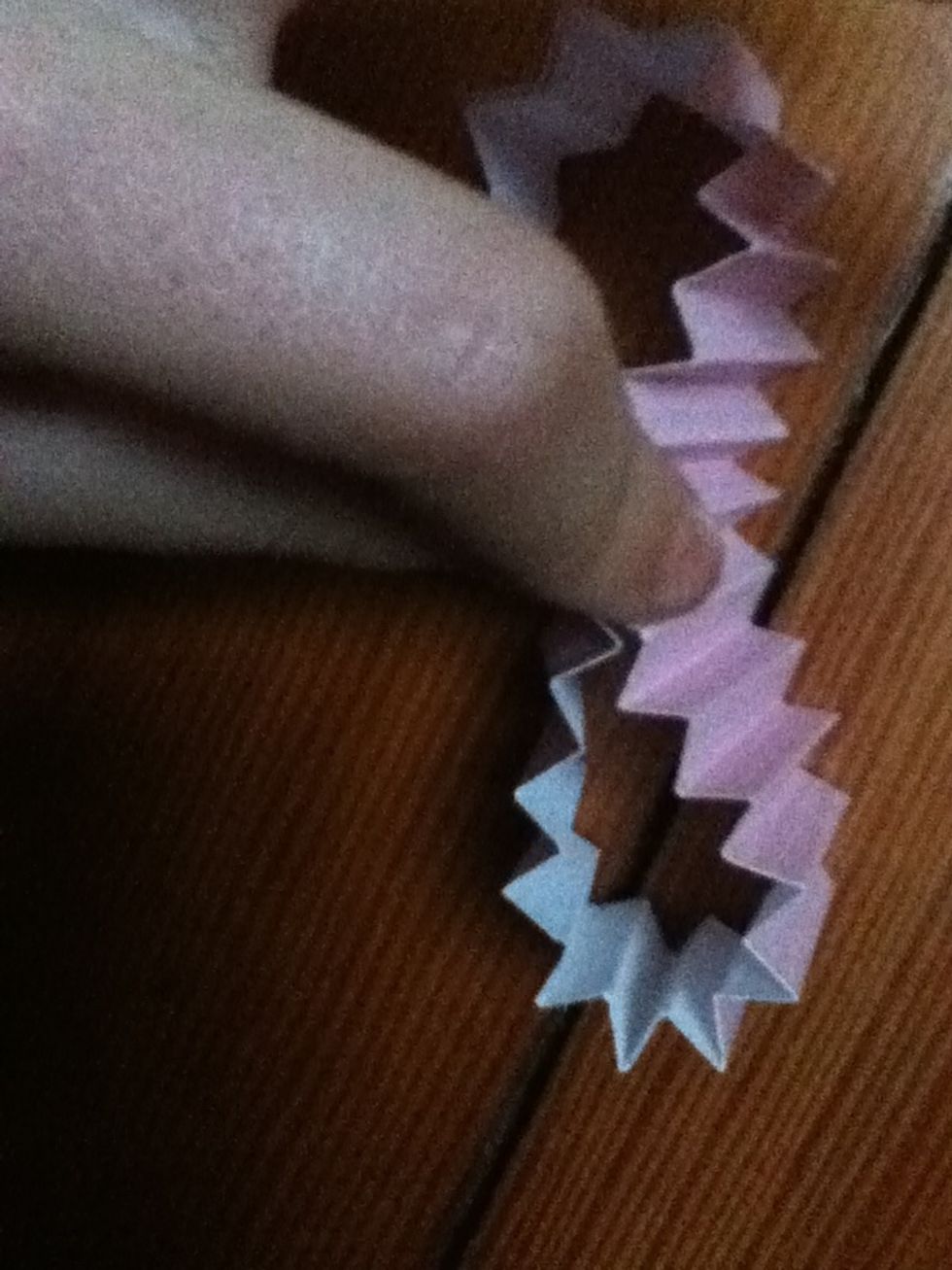 Pinch the ring in the middle.