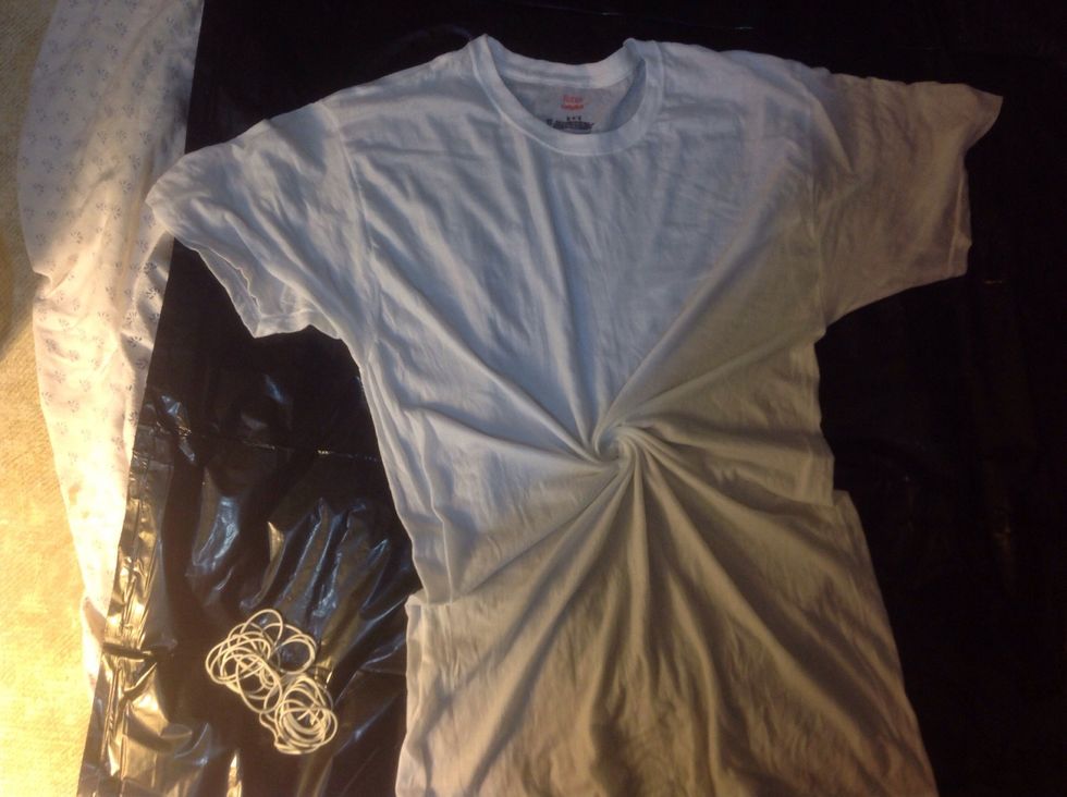 Pinch your t-shirt in the middle and twist slightly counterclockwise.