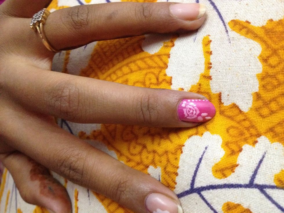 Pink base and white rose..as you can see the white takes a lil colour from the base and looks like baby pink..same trick..start with a dot keep makin fine lines around in a circular shape