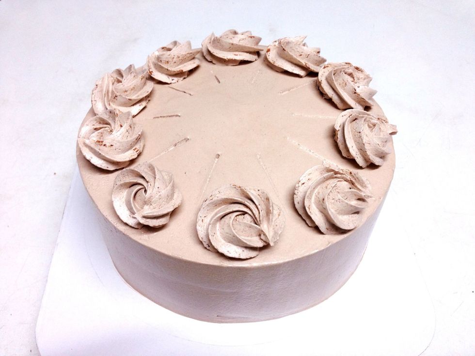 Pipe 10 buttercream roses on cake. Sprinkle Cocoa Powder ... Sprinkle White Chocolate ...