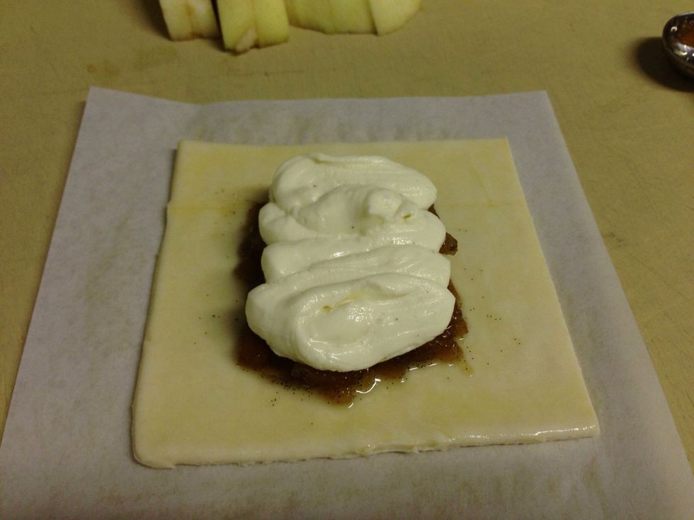 Pipe goat cheese filling on top of applesauce.
