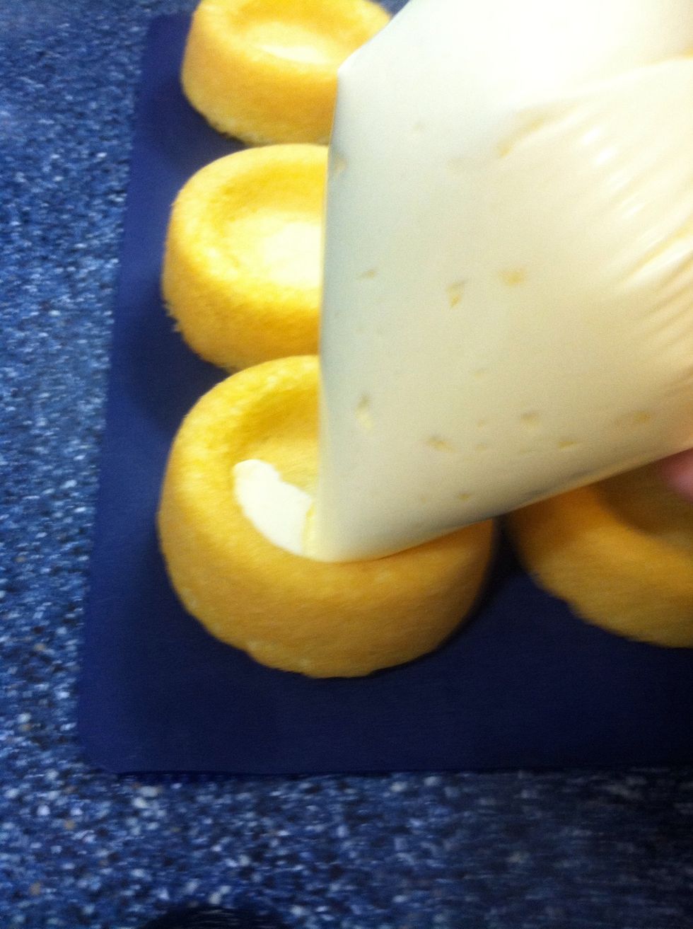 Pipe in a circular motion to fill the sponge cake.