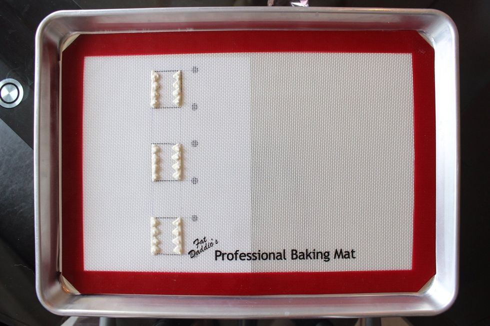 Pipe in the teeth with your white decorative icing.