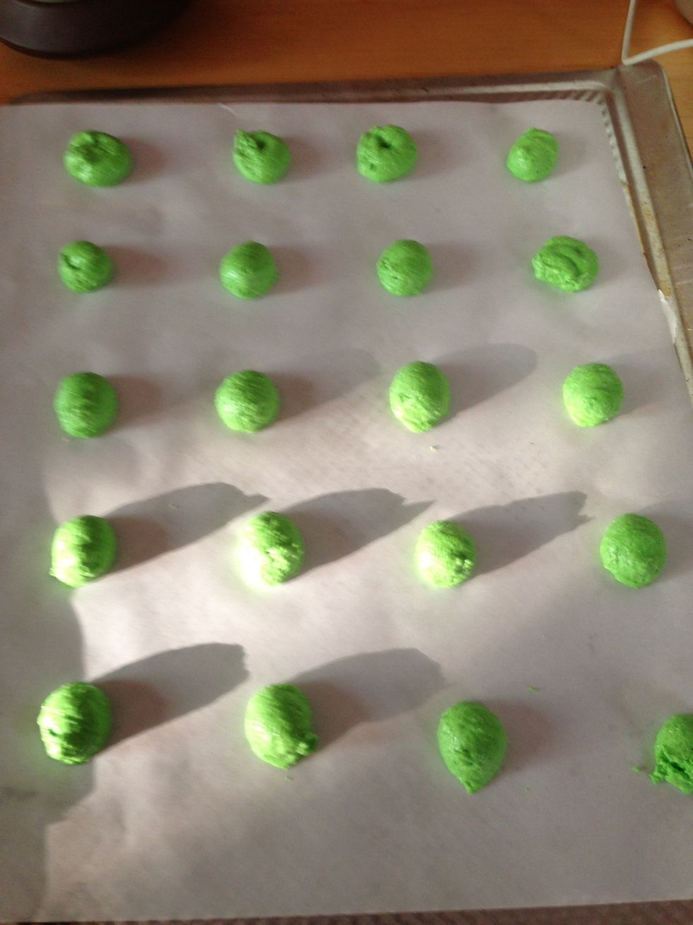 Pipe onto a baking sheet covered in parchment paper. Use a stencil drawn on the WRONG side of paper or freehand the cookies. Bang trays against table to get the air bubbles out and let sit for 15-20