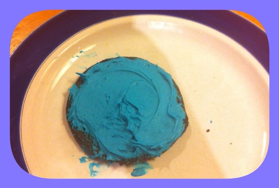 Pipe or spread some filling on on one of your cookies, how much is up to you