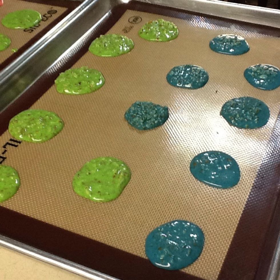 Pipe round of the similar sizes and at least one inch apart from each other on the baking sheet. If you want them to be easier to take off when they're done, you can use the parchment paper.