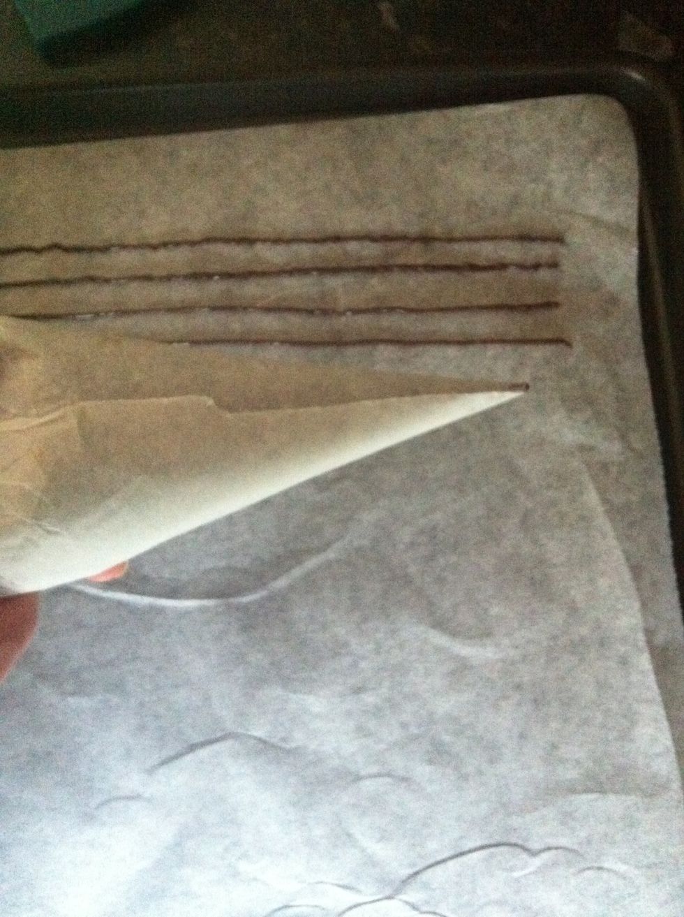 pipe straight lines on a sheet of parchment paper