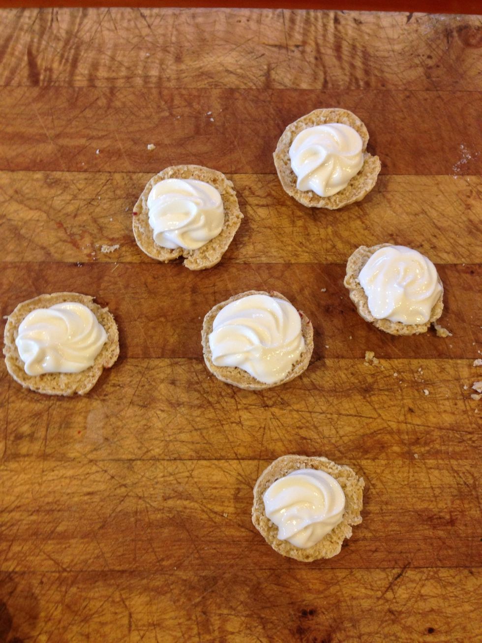 Pipe swirls on each of your halved tarts!