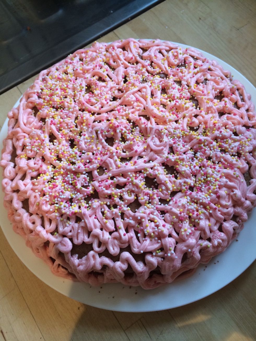 Pipe the rest off the butter cream in a similar messy design as the picture and add hundreds and thousands