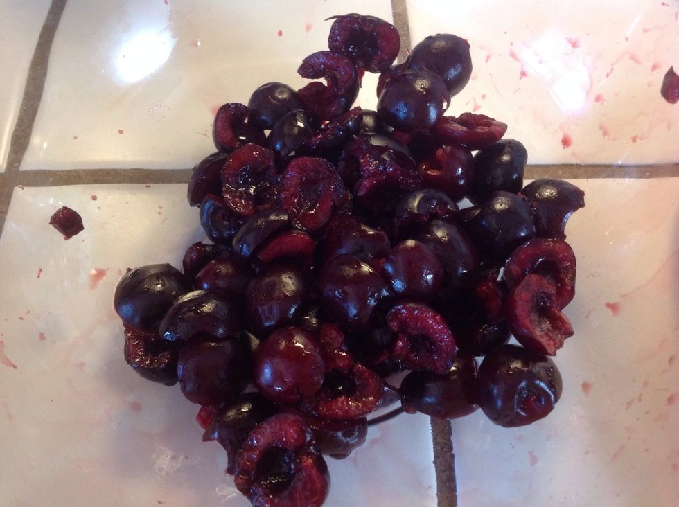 Pit cherries, cut in half.