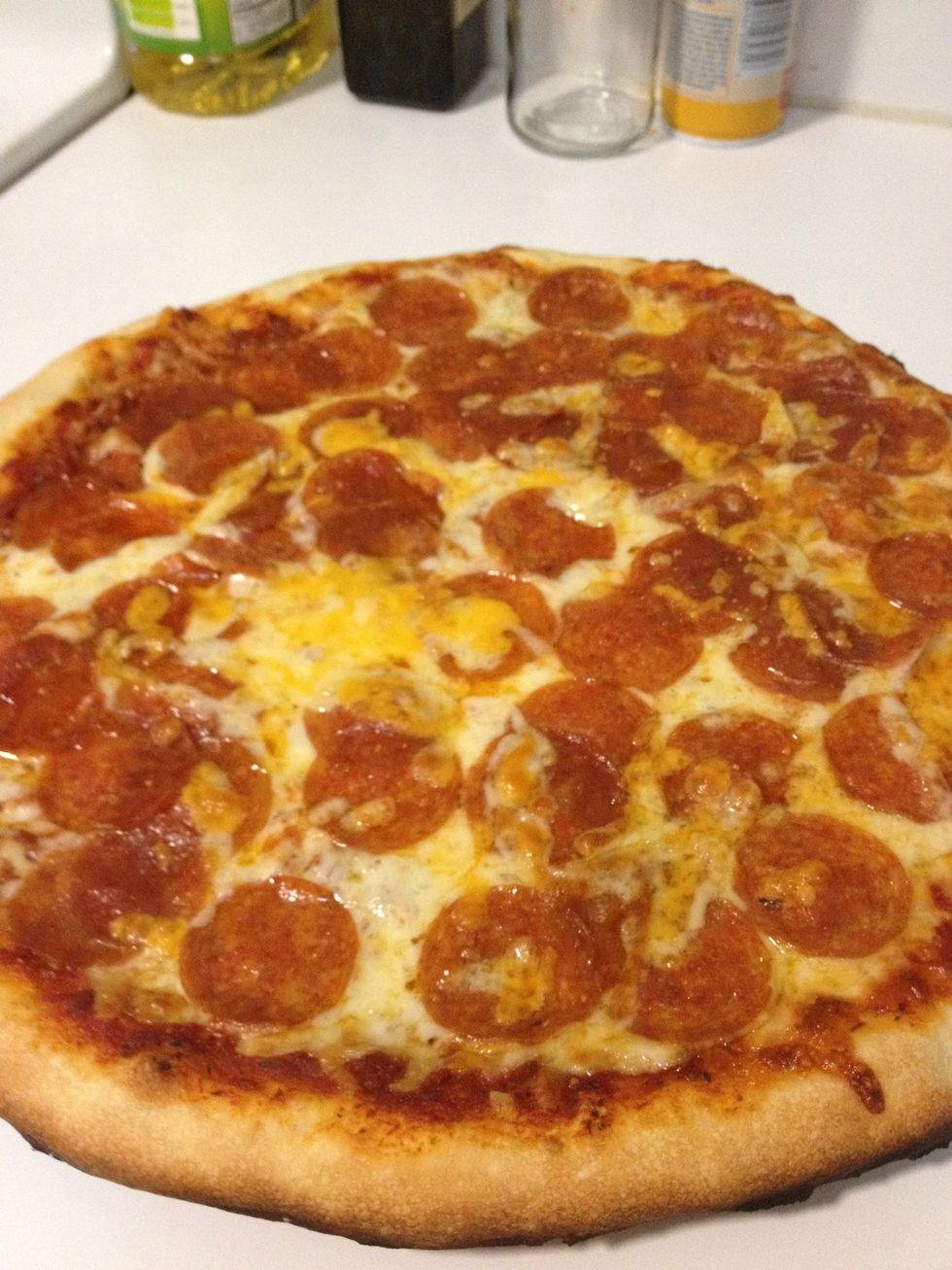 Pizza is done! You will want to let it sit for 5 minutes to let it cool/rest. Then you can slice it how you like it, and enjoy!! (Don't forget to turn your grill off!)