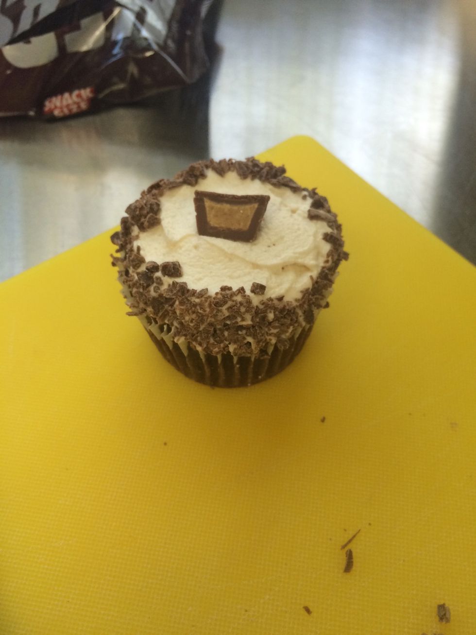 Place 1/2 of the Reese's cup on top of the cupcake.