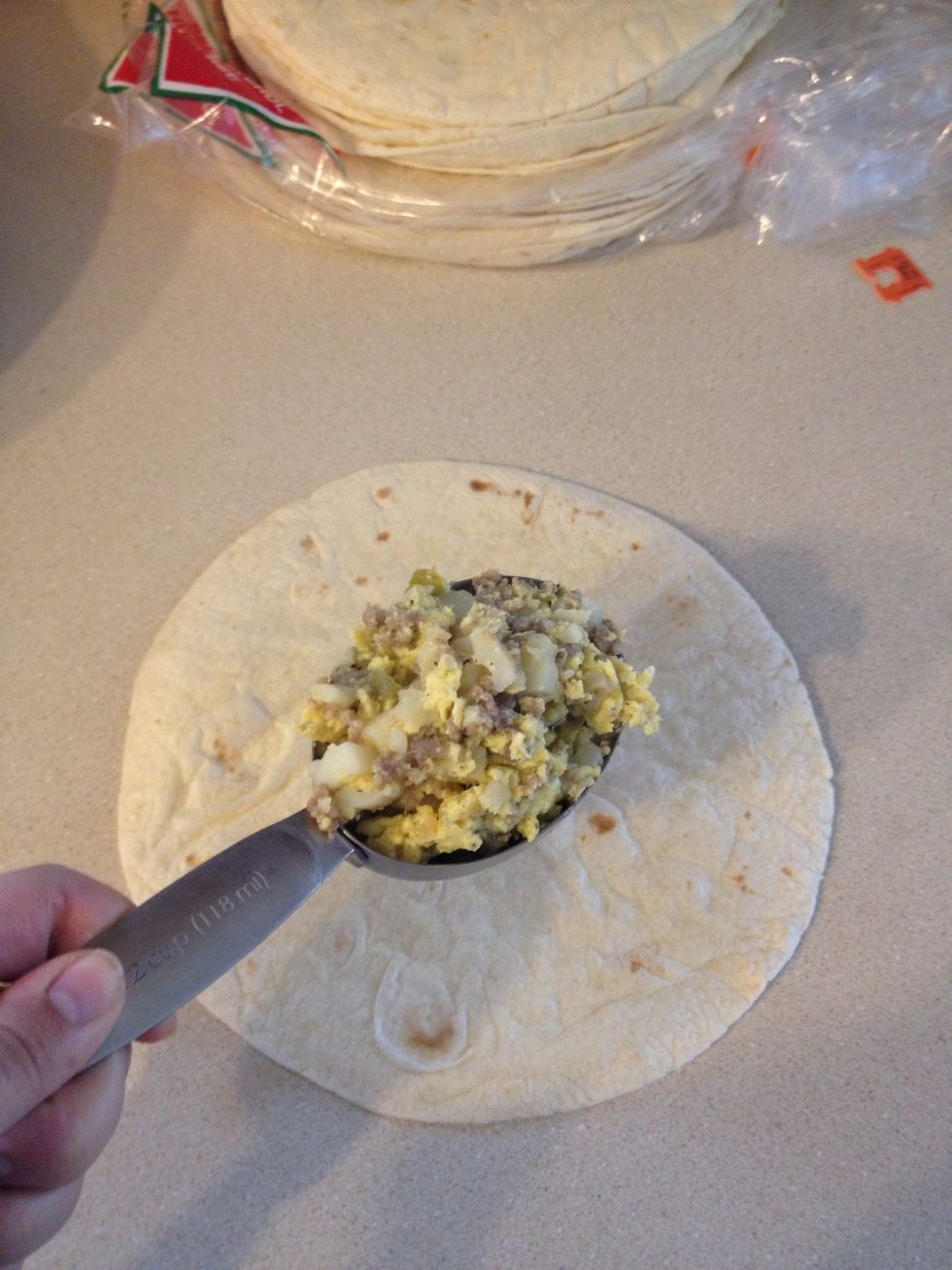 Place 1/3 cup of mixture in the tortilla.