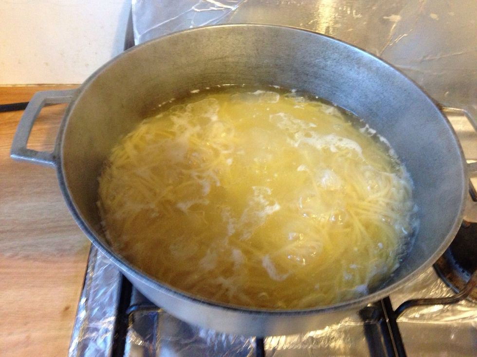 Place 1 family size box of spaghetti to boil.
