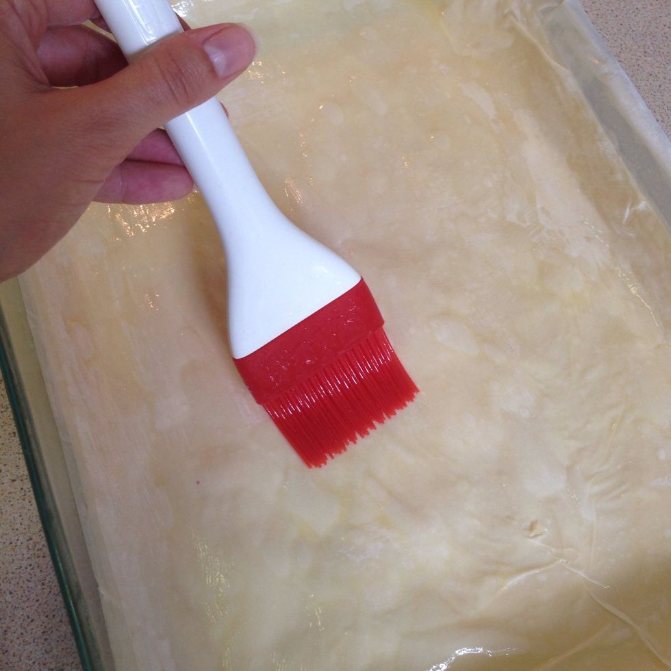 Place 1 sheet of FILO dough on baking tray, brushing lightly and evenly with butter. Place another sheet of FILO on top and repeat this step until you have 20 layers of buttered FILO.