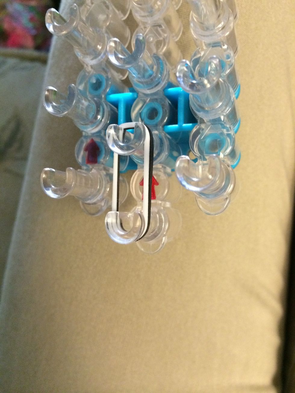 Place 1 white and black band, this is going to be the tail.