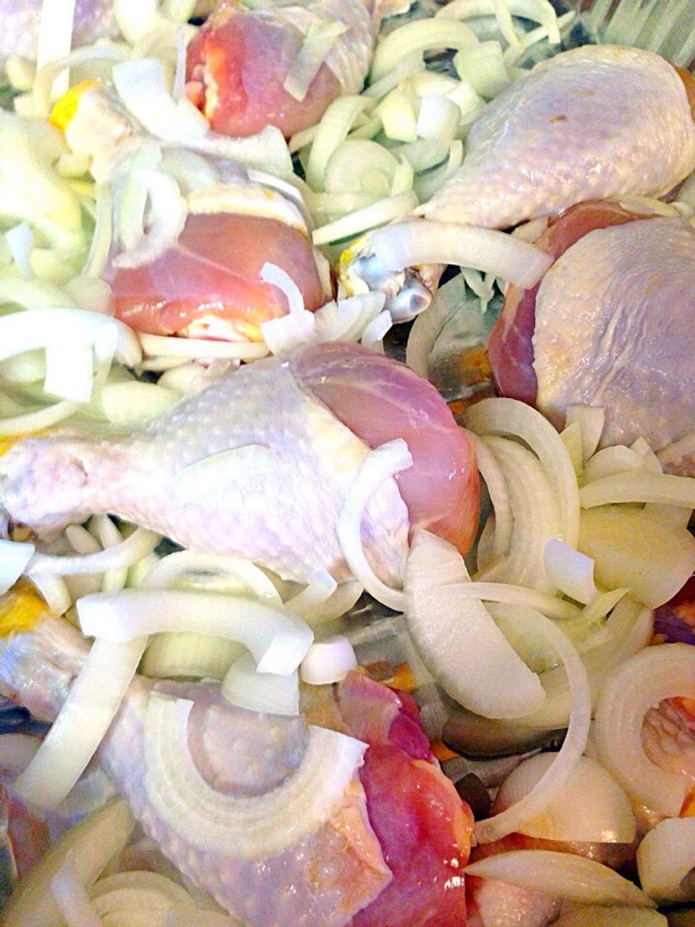 Place 10 chicken drumsticks on a baking dish. Slice 2 medium onions and add to your chicken