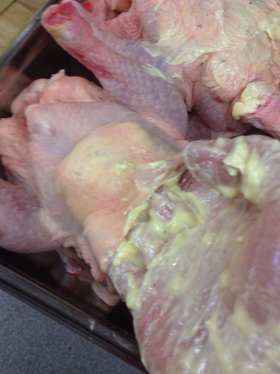 Place 2/3 of the butter mix under the skin of the chicken & press it down gently, rub the remaining butter over the rest of the chicken