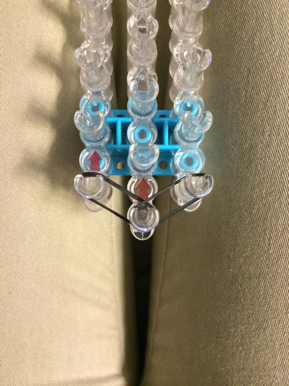 Place 2 black bands from the center to the right and left.