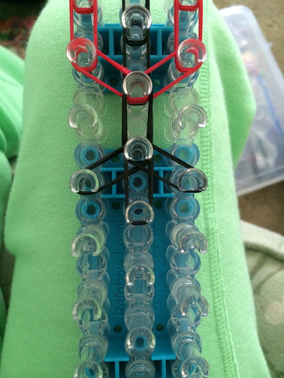 Place 2 black bands to the left to the right and down the middle.