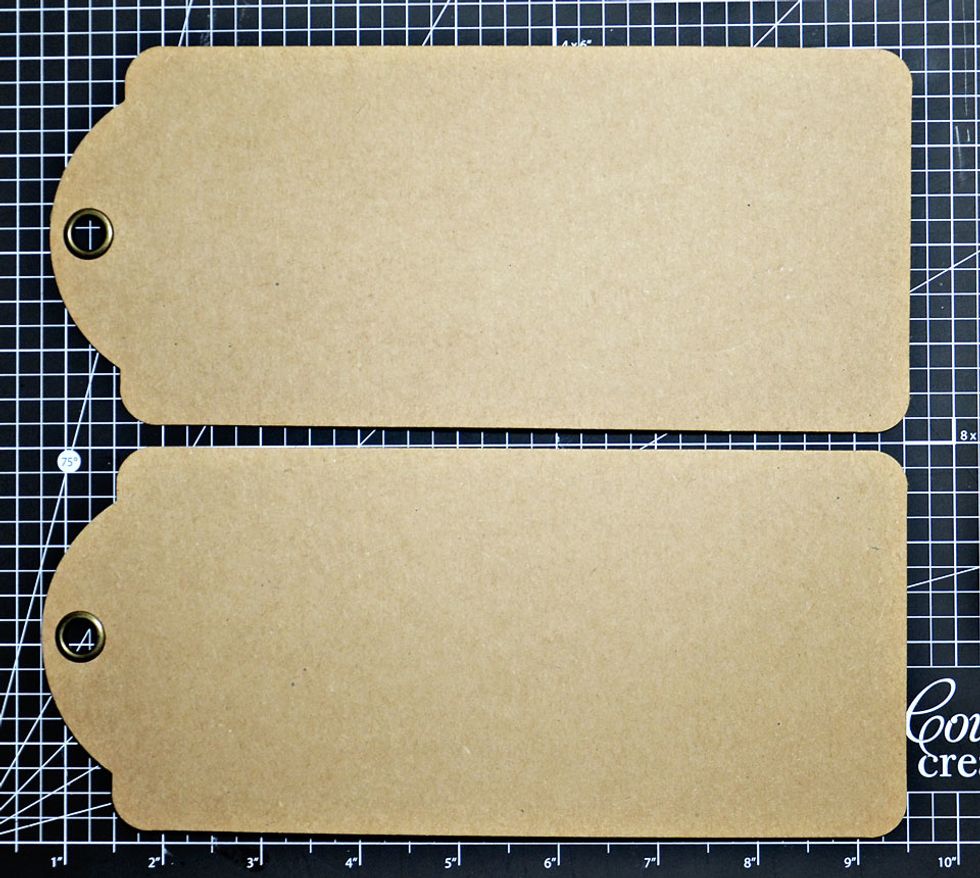 Place 2 large Graphic 45 Kraft Tags onto cutting mat.