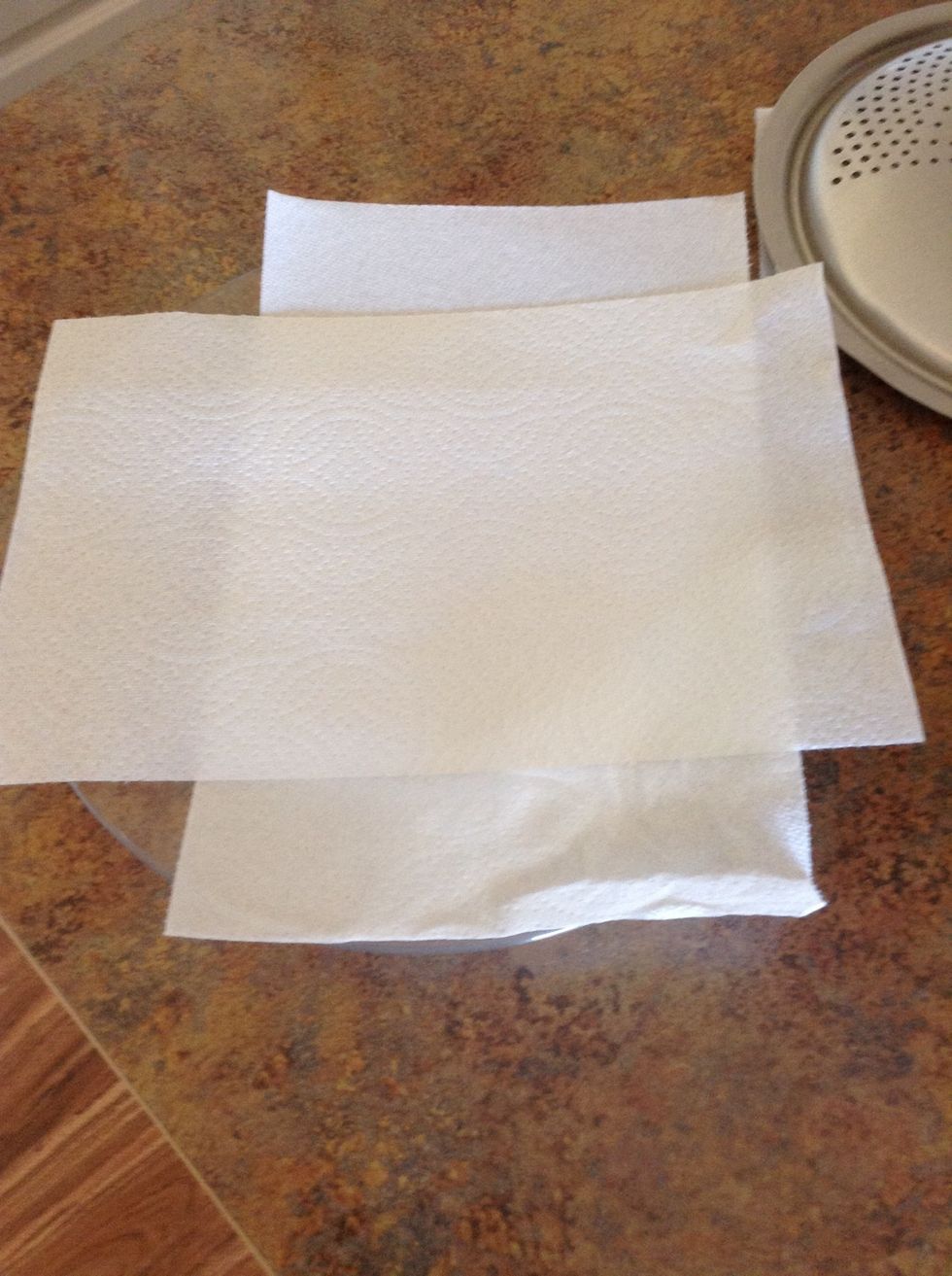 Place 2 pieces of paper towel on a plate