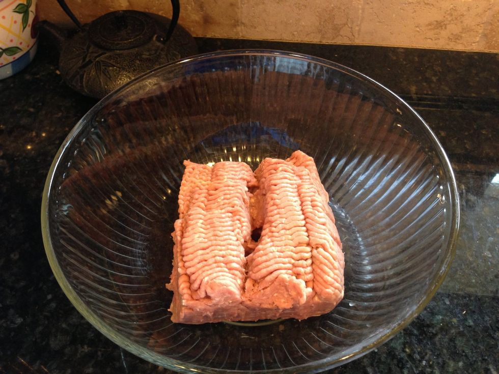 Place 2 pounds of ground turkey in a large bowl