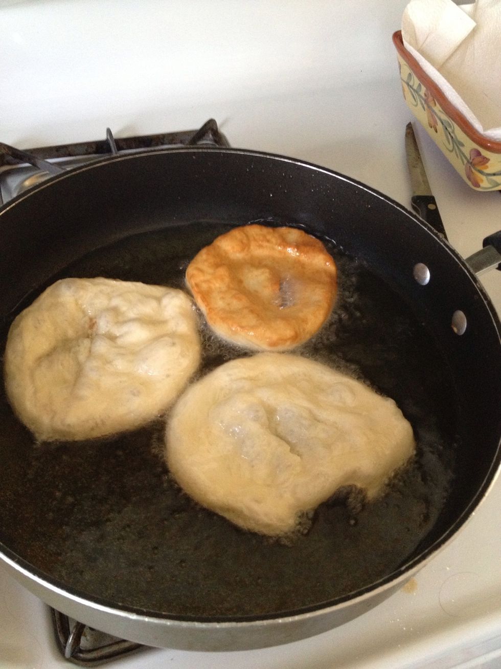 Place 3-4 pieces in your pan at a time--immediately after shaping in prior step. Dough should be able to float.