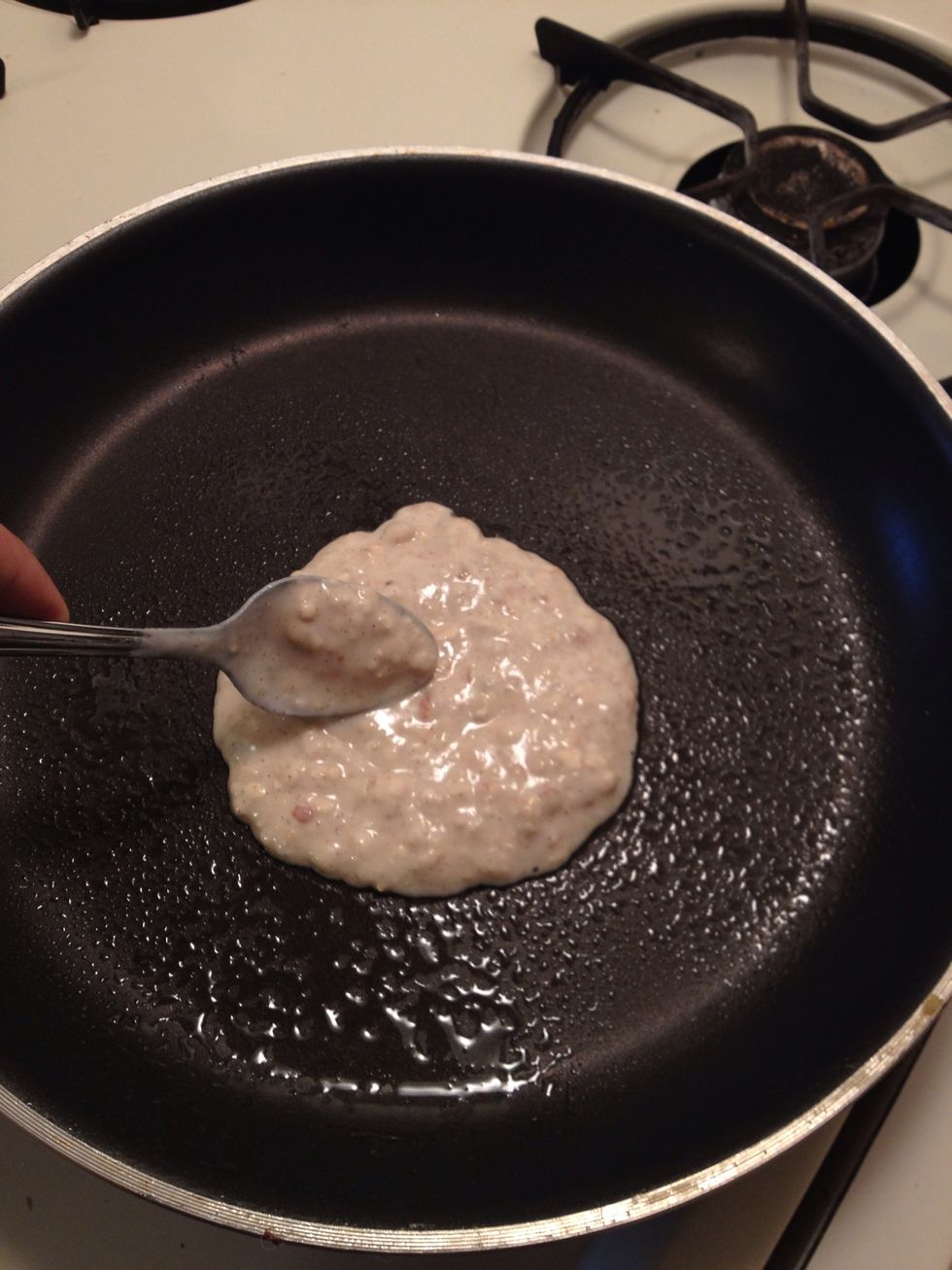 Place 3-4 spoonfuls of batter into pan