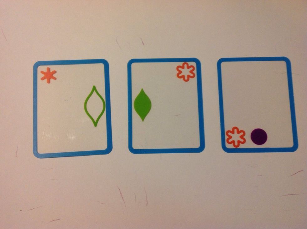 Place 3 cards on the table, with 2 of the 3 cards being a match. Instruct the learner to call out "Swish!" when he/she sees the match, pick up the match, then replace the 2 cards from a draw pile.