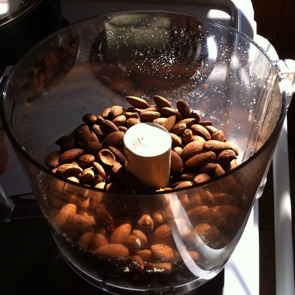 Place 3 cups of almonds and cinnamon (if using) into your food processor with the metal "S" blade. *Note: Fresh roasted almonds yield the quickest results.