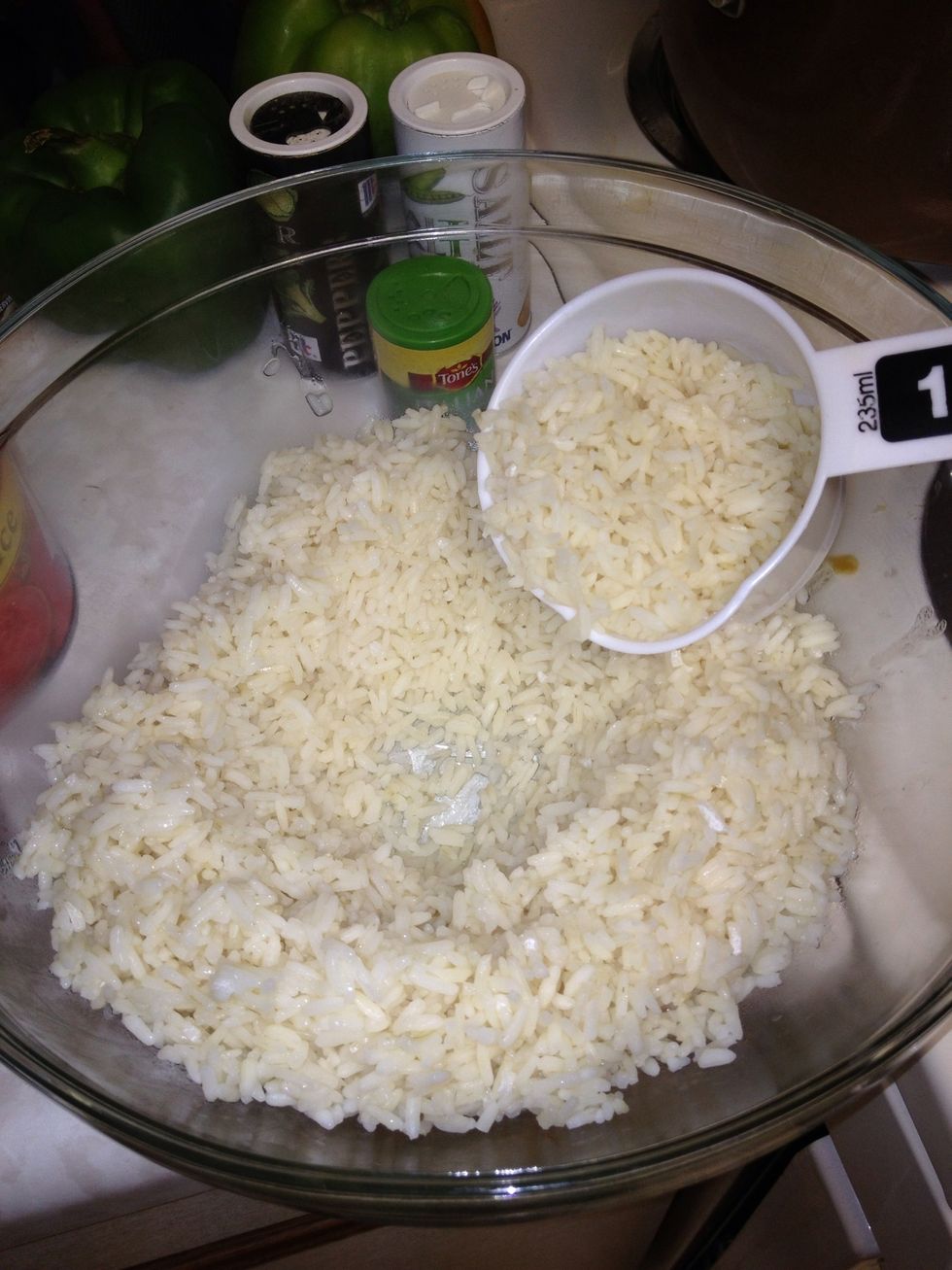 Place 3 cups of cooked rice into a large mixing bowl.