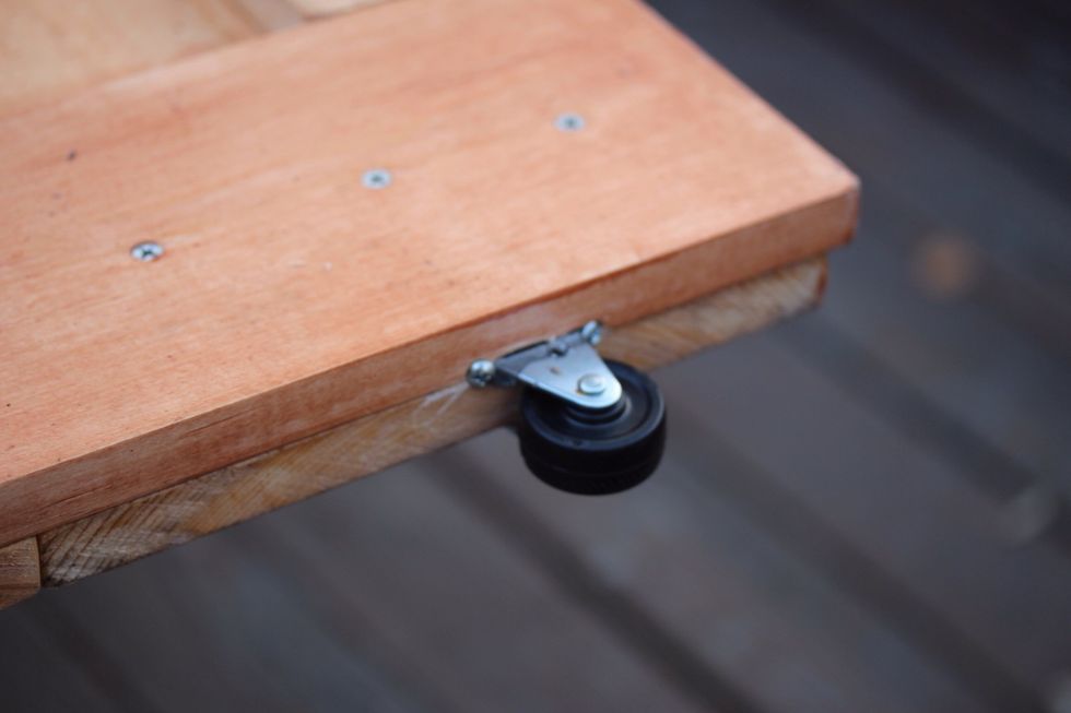 Place 3 wheels at the bottom of the door. I took the smallest caster I could find from Home Depot and cut the tops so I could sink them into the door.