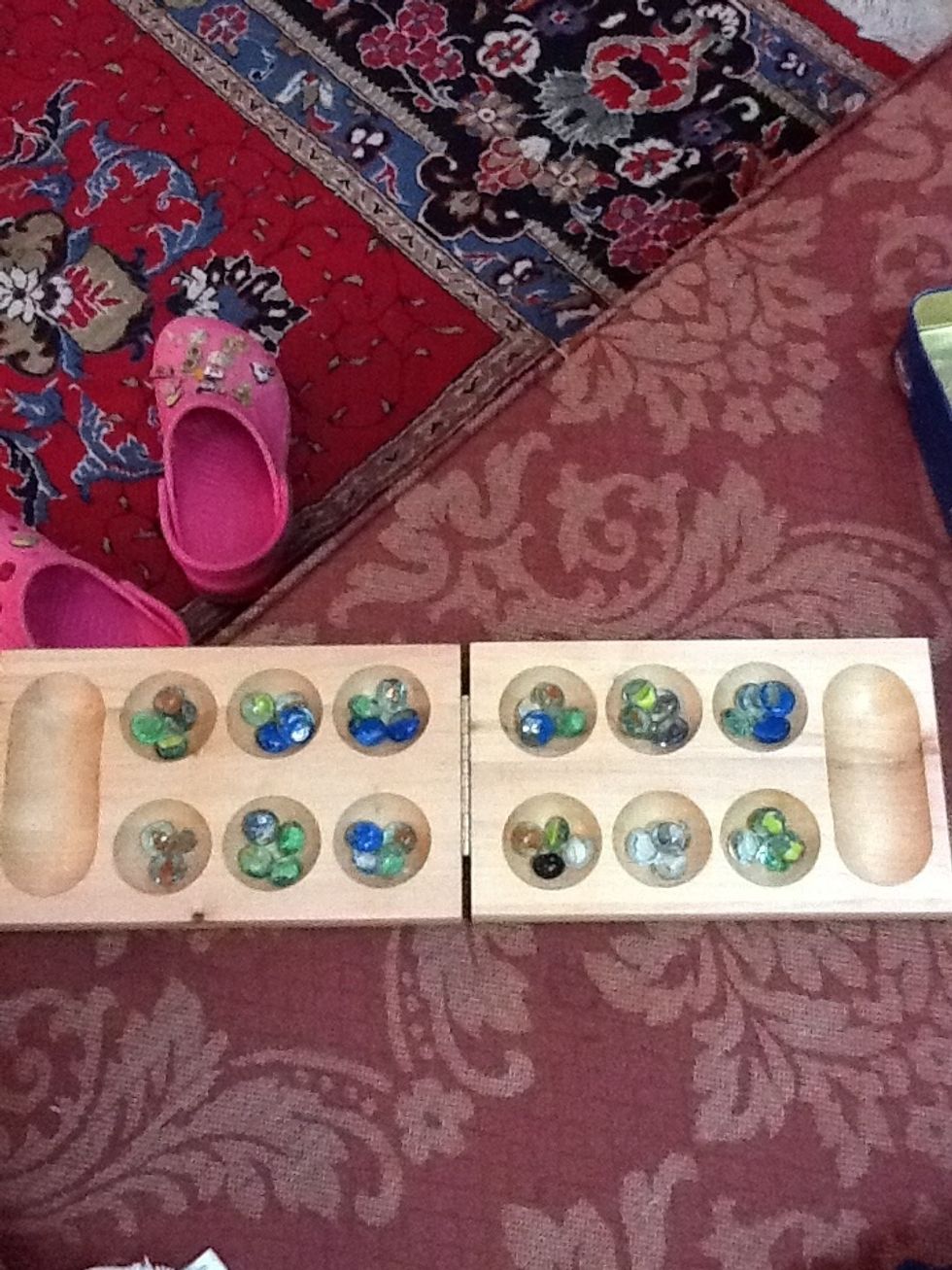 Place 4 gemstones in each hole