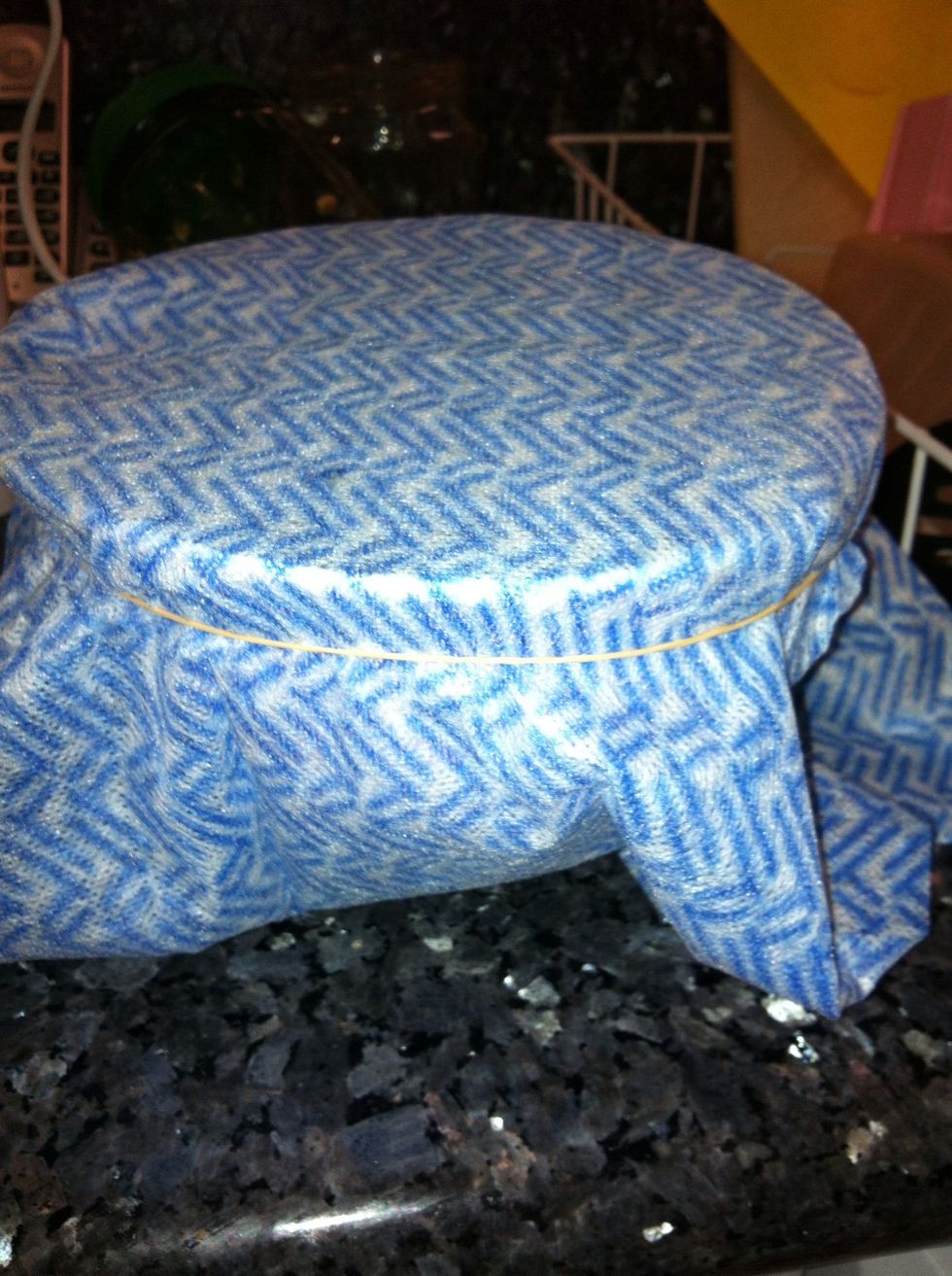 Place a chucks cloth around a bowl and secure with rubber band