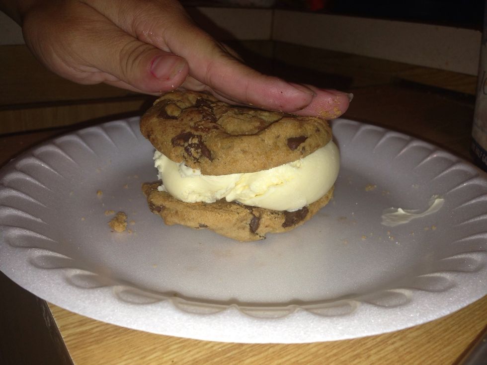 Place a cookie on top. At this point, if you would like to roll the sides in sprinkles, chocolate chips, etc. Enjoy!