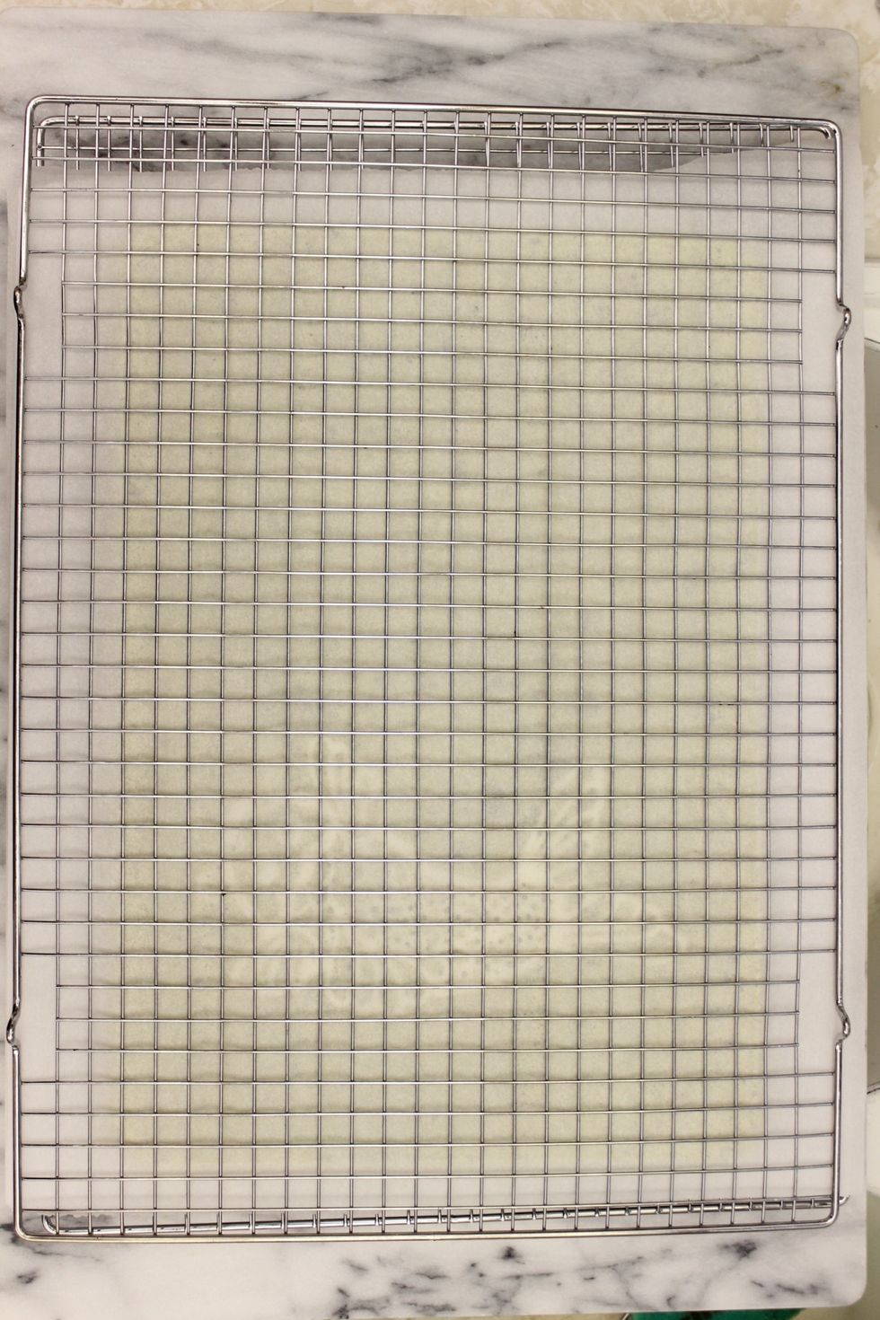 Place a cooling rack on top. Hold everything securely together and flip over.