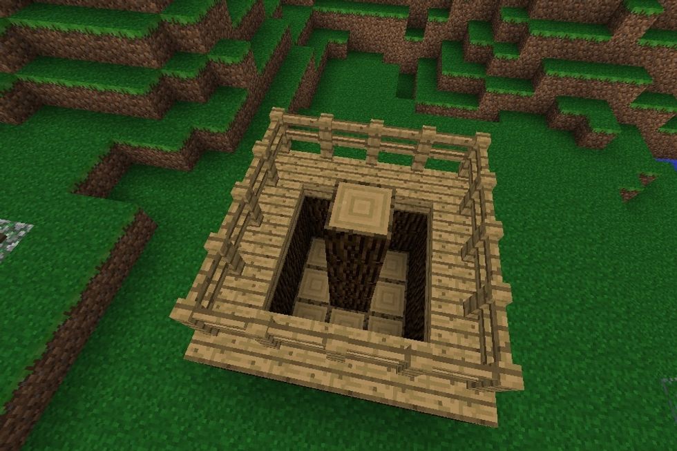 Place a couple of oak wood blocks on top of the middle block