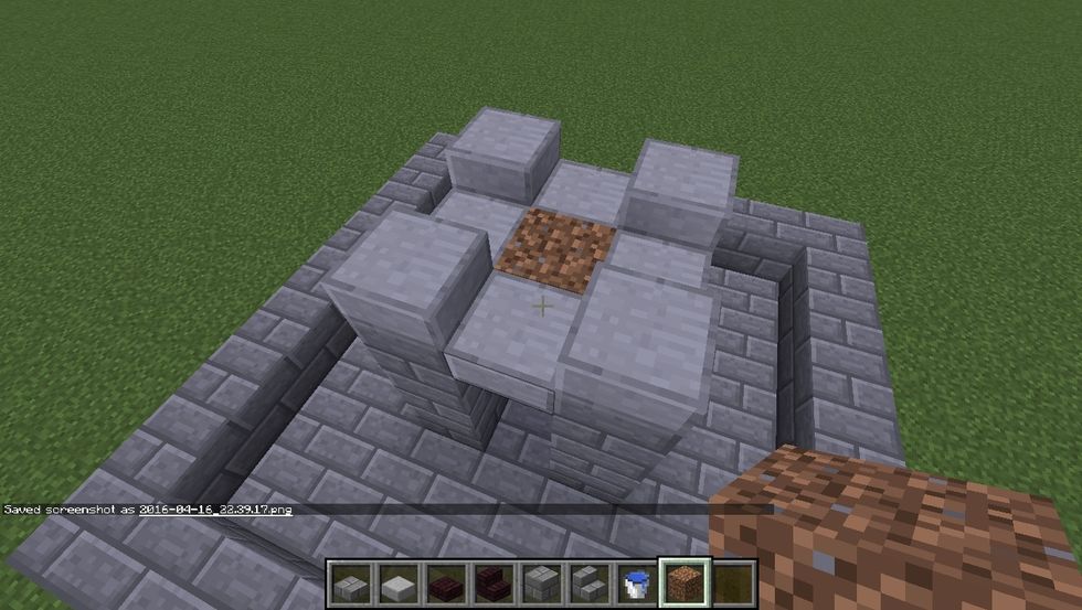 Place a Dirt block in the center. This will be removed, but is needed for the water to be placed on top of.