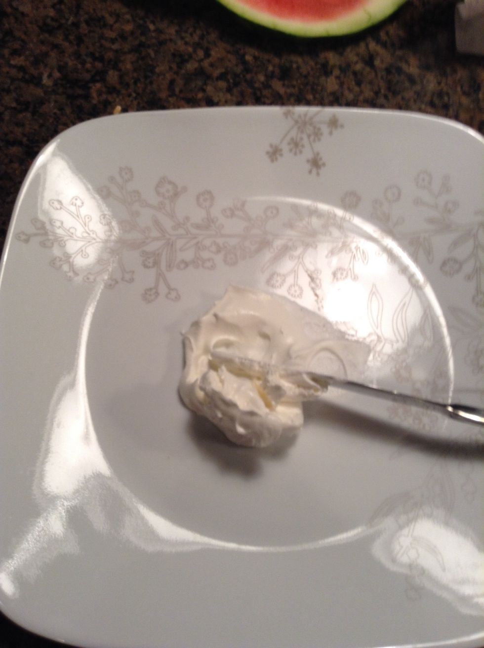 Place a dollop of cool whip on the presenting plate so the water melon cube will hold firmly to it.