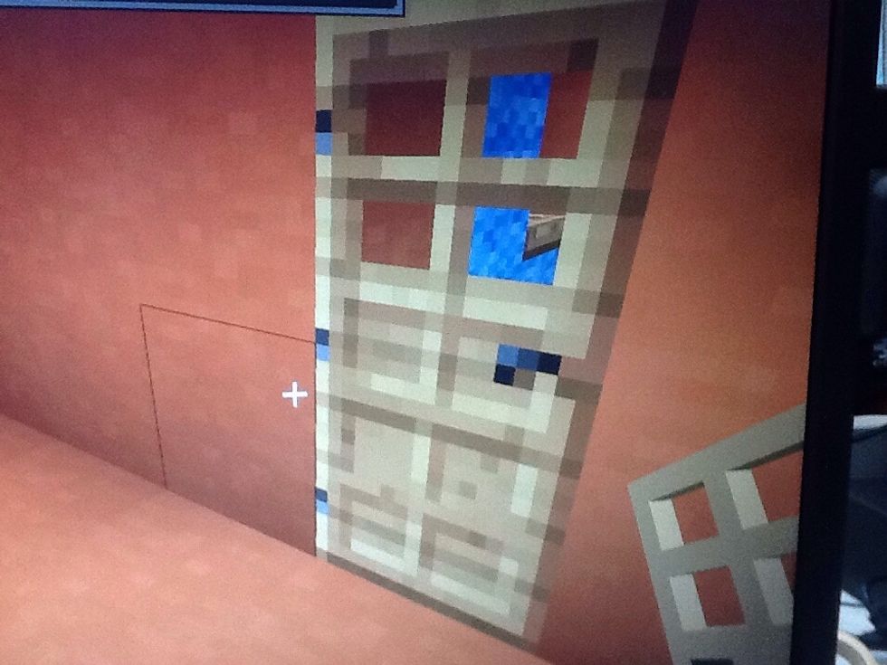 Place a door in the wall any were for the toilet.