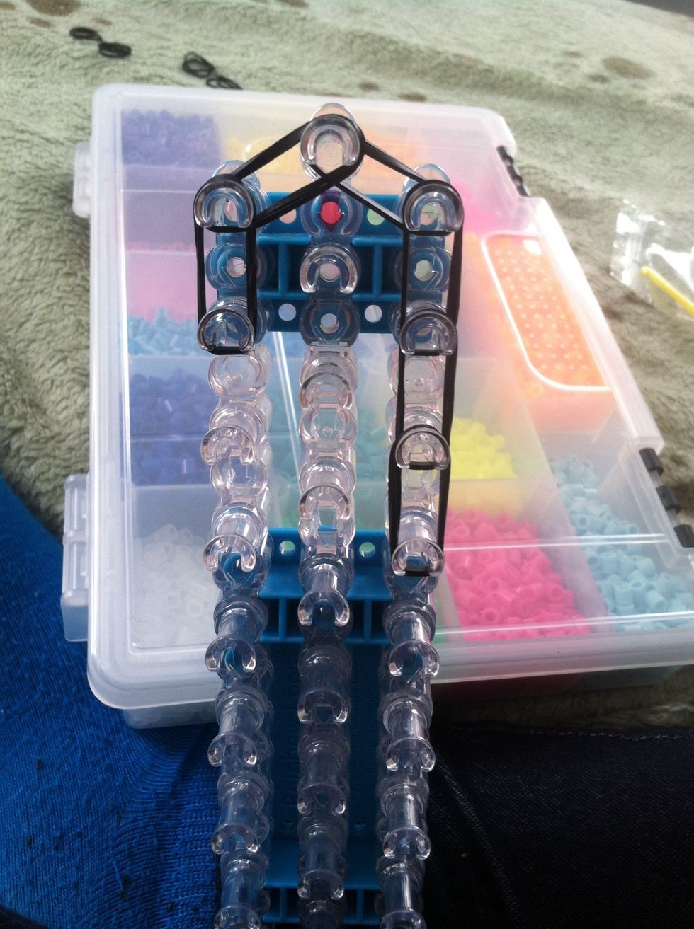 Place a double band down from the diagonal band, do that 3 times to match the right side