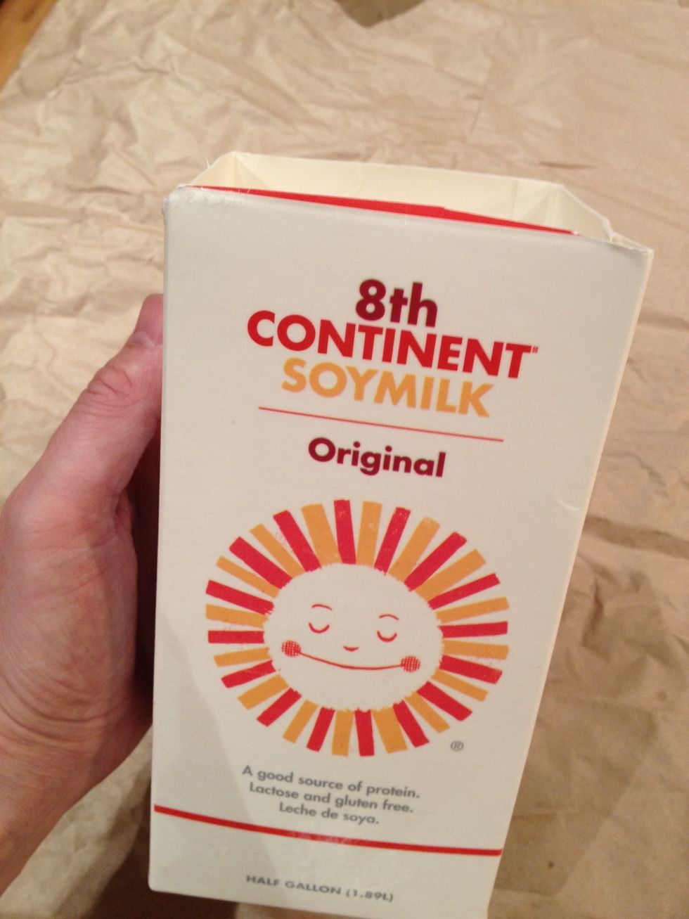 Place a drop cloth on the floor and some butcher paper on the counter. If you drop any wax, this will make cleaning up infinitely easier. Then, clean and cut off the top of an empty milk carton.