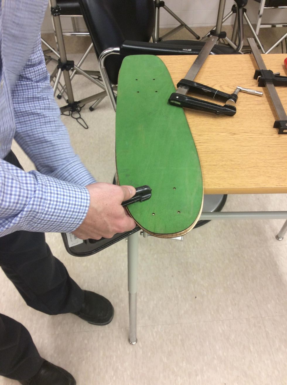 Place a F-Clamp close to one of the pre-drilled holes