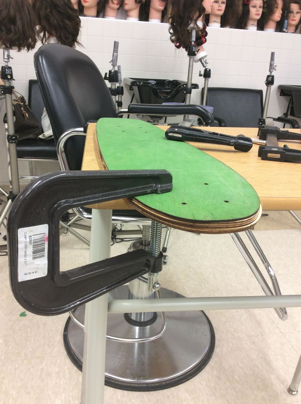 Place a F-Clamp close to one of the pre-drilled holes