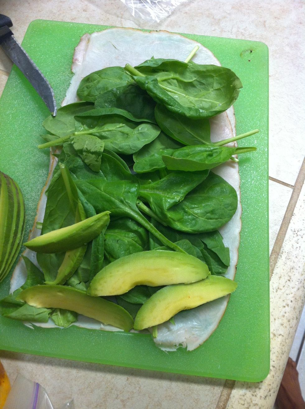 Place a few pieces of avocado at the top of your roll.