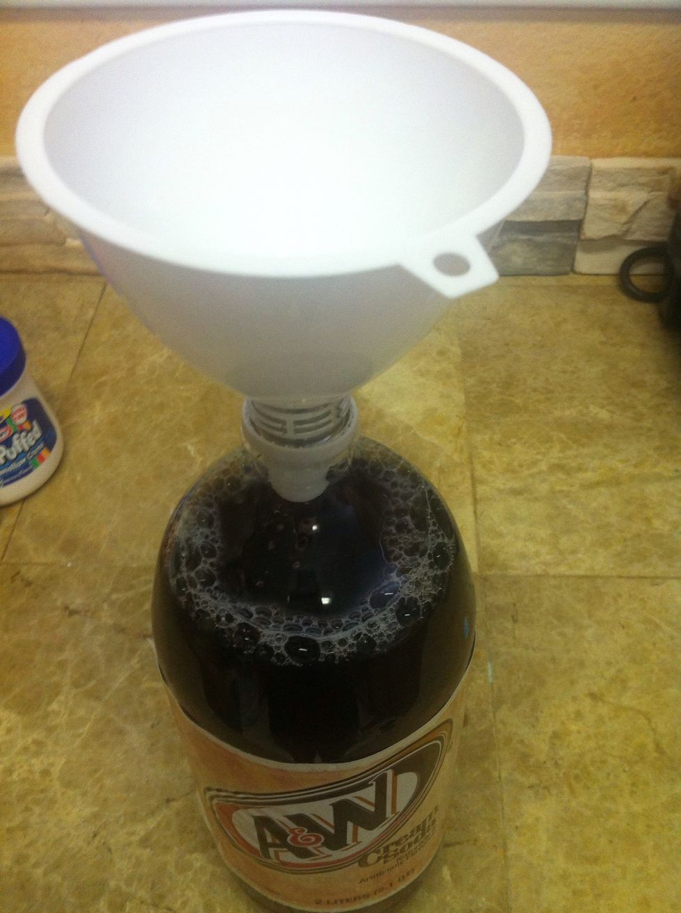 Place a funnel in the bottle...