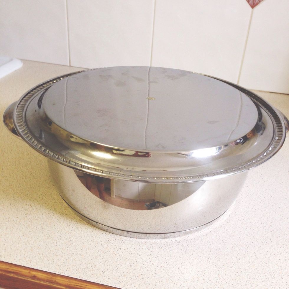 Place a large serving plate over the pot and flip pot upside-sown.